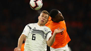 AMSTERDAM, NETHERLANDS - MARCH 24: Joshua Kimmich of Germany and Georginio Wijnaldum of the Netherlands jump for the ball during the 2020 UEFA European Championships Group C qualifying match between Netherlands and Germany at Johan Cruyff Arena on March 24, 2019 in Amsterdam, Netherlands. (Photo by Dean Mouhtaropoulos/Getty Images)