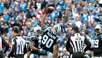 CHARLOTTE, NC - DECEMBER 24: Julius Peppers #90 of the Carolina Panthers reacts after a play against the Tampa Bay Buccaneers in the second quarter at Bank of America Stadium on December 24, 2017 in Charlotte, North Carolina. (Photo by Grant Halverson/Getty Images)