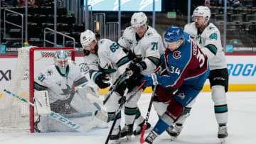 Apr 30, 2021; Denver, Colorado, USA; Colorado Avalanche center Carl Soderberg (34) battles for the puck with San Jose Sharks defenseman Erik Karlsson (65) and defenseman Nikolai Knyzhov (71) and center Tomas Hertl (48) as goaltender Martin Jones (31) defends in the first period at Ball Arena. Mandatory Credit: Isaiah J. Downing-USA TODAY Sports