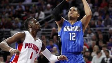 Jan 4, 2016; Auburn Hills, MI, USA; Orlando Magic forward Tobias Harris (12) attempts a shot over Detroit Pistons guard Reggie Jackson (1) during the first quarter at The Palace of Auburn Hills. Mandatory Credit: Raj Mehta-USA TODAY Sports