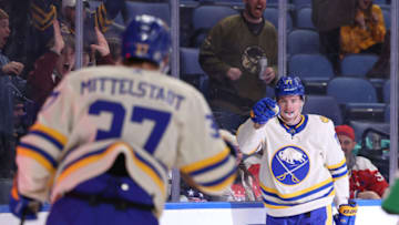 Mar 25, 2022; Buffalo, New York, USA; Buffalo Sabres left wing Victor Olofsson (71) celebrates his goal with center Casey Mittelstadt (37) during the second period against the Washington Capitals at KeyBank Center. Mandatory Credit: Timothy T. Ludwig-USA TODAY Sports