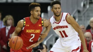 Jan 9, 2016; Madison, WI, USA; Maryland Terrapins guard Melo Trimble (2) moves the ball against Wisconsin Badgers guard Jordan Hill (11) at the Kohl Center. Maryland defeated Wisconsin 63-60. Mandatory Credit: Mary Langenfeld-USA TODAY Sports