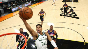PHOENIX, ARIZONA - JULY 08: Milwaukee Bucks forward Giannis Antetokounmpo (34) moves in for a basket ahead of Phoenix Suns forward Jae Crowder (99) and guard Chris Paul (3) in Game Two of the NBA Finals at Phoenix Suns Arena on July 08, 2021 in Phoenix, Arizona. NOTE TO USER: User expressly acknowledges and agrees that, by downloading and or using this photograph, User is consenting to the terms and conditions of the Getty Images License Agreement. (Photo by Mark J. Rebilas-Pool/Getty Images)