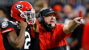 ATLANTA, GEORGIA - JANUARY 01: Georgia Bulldogs head coach Kirby Smart (right) directs defensive back Richard Lecounte #2 during the Chick-fil-A Peach Bowl against the Cincinnati Bearcats at Mercedes-Benz Stadium on January 01, 2021 in Atlanta, Georgia. (Photo by Mike Zarrilli/Getty Images)