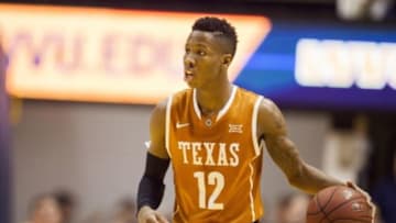 Jan 20, 2016; Morgantown, WV, USA; Texas Longhorns guard Kerwin Roach Jr. (12) dribbles the ball up the floor during the first half against the West Virginia Mountaineers at the WVU Coliseum. Mandatory Credit: Ben Queen-USA TODAY Sports