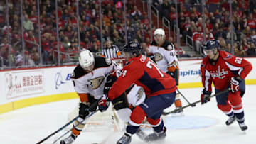 WASHINGTON, DC - FEBRUARY 11: Brandon Montour #71 of the Anaheim Ducks and John Carlson #74 of the Washington Capitals go after the puck in the second period at Verizon Center on February 11, 2017 in Washington, DC. (Photo by Rob Carr/Getty Images)