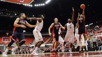 Feb 3, 2016; Pullman, WA, USA; Arizona Wildcats guard Parker Jackson-Cartwright (0) goes up for a shot against Washington State Cougars forward Junior Longrus (15) during the second half at Wallis Beasley Performing Arts Coliseum. The Wildcats won 79-64. Mandatory Credit: James Snook-USA TODAY Sports