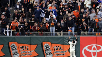 Oct 11, 2016; San Francisco, CA, USA; San Francisco Giants right fielder Gregor Blanco (7) jumps for Chicago Cubs catcher David Ross (3) home run during the third inning of game four of the 2016 NLDS playoff baseball game at AT&T Park. Mandatory Credit: Kelley L Cox-USA TODAY Sports