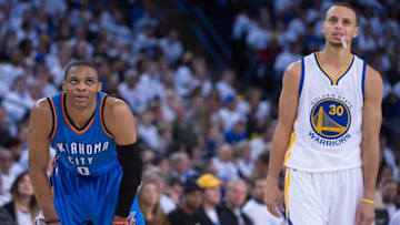 January 5, 2015; Oakland, CA, USA; Oklahoma City Thunder guard Russell Westbrook (0) and Golden State Warriors guard Stephen Curry (30) look on during the third quarter at Oracle Arena. The Warriors defeated the Thunder 117-91. Mandatory Credit: Kyle Terada-USA TODAY Sports