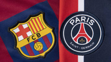The Paris Saint-Germain and FC Barcelona club crests on their first team home shirts. (Photo by Visionhaus)