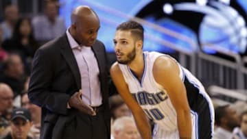 Oct 17, 2014; Orlando, FL, USA; Orlando Magic head coach Jacque Vaughn talks with guard Evan Fournier (10) during the first half against the Detroit Pistons at Amway Center. Mandatory Credit: Kim Klement-USA TODAY Sports