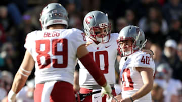 BOULDER, CO - NOVEMBER 10: Trey Tinsley #10 congratulates place kicker Blake Mazza #40 of the Wshington State Cougars after a field goal against the Colorado Buffaloes in the second quarter at Folsom Field on November 10, 2018 in Boulder, Colorado. (Photo by Matthew Stockman/Getty Images)
