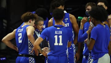 Jan 9, 2021; Gainesville, Florida, USA; Kentucky Wildcats head coach John Calipari huddles with his players during the first half against the Florida Gators at Billy Donovan Court at Exactech Arena. Mandatory Credit: Kim Klement-USA TODAY Sports