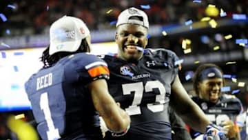 Dec 7, 2013; Atlanta, GA, USA; Auburn Tigers wide receiver Trovon Reed (1) and Auburn Tigers offensive linesman Greg Robinson (73) celebrate after the 2013 SEC Championship game against the Missouri Tigers at Georgia Dome. The Auburn Tigers defeated the Missouri Tigers 59-42. Mandatory Credit: Kevin Liles-USA TODAY Sports