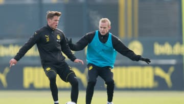 DORTMUND, GERMANY - JANUARY 25: Erik Durm of Borussia Dortmund and Sebastian Rode of Borussia Dortmund battle for the ball during a training session at the BVB Training center on January 25, 2017 in Dortmund, Germany. (Photo by TF-Images/Getty Images)