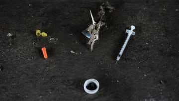 PHILADELPHIA, PA - JULY 31: Used needles are left behind in what was a heroin shooting gallery in the Kensington section of Philadelphia which has become a hub for heroin use on July 31, 2017 in Philadelphia, Pennsylvania. Today was the first day of a long anticipated clean-up of one of the largest open air drug markets on the East Coast. Hundreds of outreach workers, city employees and Conrail workers started to clear an area of heroin users from a stretch of train tracks in Philadelphia's Kensington section known as El Campamento. Over 900 people died last year in Philadelphia from opioid overdoses, a 30 percent increase from 2015. As the epidemic shows no signs of weakening, the number of fatalities this year is expected to surpass last year's numbers. Heroin use has doubled across the country since 2010, according to the DEA, part of an epidemic of opioid abuse that began in the 1990s, when doctors began prescribing higher doses of powerful painkillers. (Photo by Spencer Platt/Getty Images)