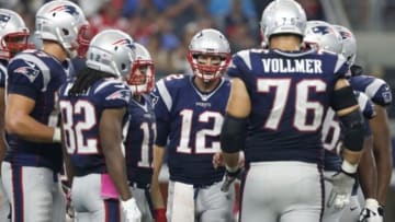 Oct 11, 2015; Arlington, TX, USA; New England Patriots quarterback Tom Brady (12)calls a play in the huddle during the second half against the Dallas Cowboys at AT&T Stadium. Mandatory Credit: Matthew Emmons-USA TODAY Sports