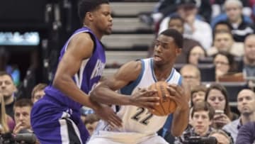 Jan 1, 2015; Minneapolis, MN, USA; Minnesota Timberwolves guard Andrew Wiggins (22) dribbles in the first quarter against the Sacramento Kings forward Rudy Gay (8) at Target Center. Mandatory Credit: Brad Rempel-USA TODAY Sports