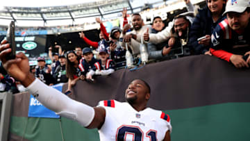 EAST RUTHERFORD, NEW JERSEY - OCTOBER 30: Jonnu Smith #81 of the New England Patriots celebrates with fans after a game against the New York Jets at MetLife Stadium on October 30, 2022 in East Rutherford, New Jersey. (Photo by Elsa/Getty Images)