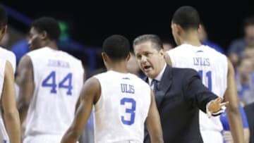 Nov 23, 2014; Lexington, KY, USA; Kentucky Wildcats head coach John Calipari talks with guard Tyler Ulis (3) during the game against the Montana State Bobcats in the second half at Rupp Arena. Kentucky defeated Montana State 86-28. Mandatory Credit: Mark Zerof-USA TODAY Sports