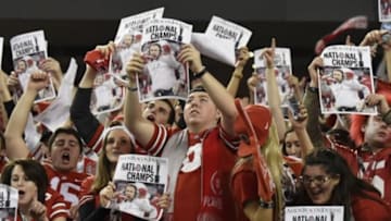 Jan 12, 2015; Arlington, TX, USA; Ohio State Buckeyes fans hold up signs celebrating their victory over the Oregon Ducks in the 2015 CFP National Championship Game at AT&T Stadium. Ohio State won 42-20. Mandatory Credit: Kirby Lee-USA TODAY Sports