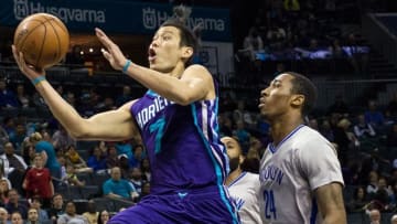 Apr 8, 2016; Charlotte, NC, USA; Charlotte Hornets guard Jeremy Lin (7) goes up for a shot against Brooklyn Nets guard Rondae Hollis-Jefferson (24) during the first half at Time Warner Cable Arena. Mandatory Credit: Jeremy Brevard-USA TODAY Sports