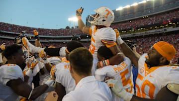 Oct 1, 2016; Athens, GA, USA; Tennessee Volunteers wide receiver Jauan Jennings (C) is carried off the field by team mates after catching the game winning touchdown pass against the Georgia Bulldogs on the last play on the game during the fourth quarter at Sanford Stadium. Tennessee defeated Georgia 34-31. Mandatory Credit: Dale Zanine-USA TODAY Sports