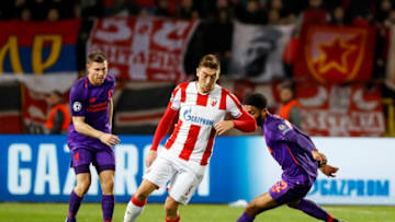 BELGRADE, SERBIA - NOVEMBER 06: Milan Pavkov (C) of Crvena Zvezda in action against Joel Matip (R) and James Milner (L) of Liverpool during the Group C match of the UEFA Champions League between Red Star Belgrade and Liverpool at Rajko Mitic Stadium on November 06, 2018 in Belgrade, Serbia. (Photo by Srdjan Stevanovic/Getty Images)