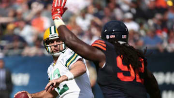 CHICAGO, IL - SEPTEMBER 13: Aaron Rodgers #12 of the Green Bay Packers passes under pressure from Pernell McPhee #92 of the Chicago Bears at Soldier Field on September 13, 2015 in Chicago, Illinois. The Packers defeated the Bears 31-23. (Photo by Jonathan Daniel/Getty Images)
