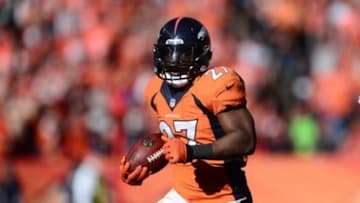 January 19, 2014; Denver, CO, USA; Denver Broncos running back Knowshon Moreno (27) runs the ball against the New England Patriots in the first half of the 2013 AFC Championship football game at Sports Authority Field at Mile High. Mandatory Credit: Ron Chenoy-USA TODAY Sports