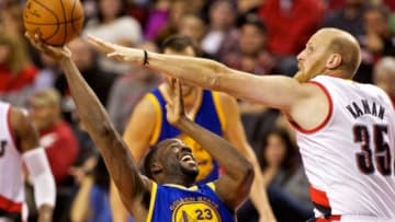 Nov 2, 2014; Portland, OR, USA; Golden State Warriors forward Draymond Green (23) is fouled by Portland Trail Blazers center Chris Kaman (35) during the third quarter at the Moda Center. Mandatory Credit: Craig Mitchelldyer-USA TODAY Sports