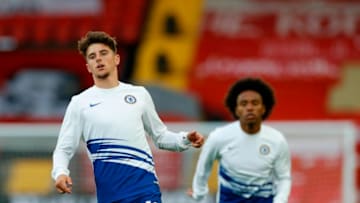 Chelsea's English midfielder Mason Mount (L) and Chelsea's Brazilian midfielder Willian (R) warm up for the English Premier League football match between Liverpool and Chelsea at Anfield in Liverpool, north west England on July 22, 2020. (Photo by PHIL NOBLE / POOL / AFP) / RESTRICTED TO EDITORIAL USE. No use with unauthorized audio, video, data, fixture lists, club/league logos or 'live' services. Online in-match use limited to 120 images. An additional 40 images may be used in extra time. No video emulation. Social media in-match use limited to 120 images. An additional 40 images may be used in extra time. No use in betting publications, games or single club/league/player publications. / (Photo by PHIL NOBLE/POOL/AFP via Getty Images)