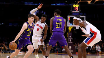 Austin Reaves #15 of the Los Angeles Lakers uses the screen of Thomas Bryant #31 in front of Hamidou Diallo #6 and Jalen Duren #0 of the Detroit Pistons (Photo by Harry How/Getty Images)
