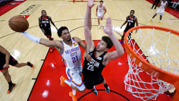 Aaron Wiggins #21 of the Oklahoma City Thunder dunks the ball over Alperen Sengun #28 of the Houston Rockets during the second half at Toyota Center on November 29, 2021 in Houston, Texas. NOTE TO USER: User expressly acknowledges and agrees that, by downloading and or using this photograph, User is consenting to the terms and conditions of the Getty Images License Agreement. (Photo by Carmen Mandato/Getty Images)