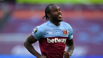 West Ham United's English midfielder Michail Antonio celebrates after scoring the opening goal of the English Premier League football match between West Ham United and Watford at The London Stadium, in east London on July 17, 2020. (Photo by Justin Setterfield / POOL / AFP) / RESTRICTED TO EDITORIAL USE. No use with unauthorized audio, video, data, fixture lists, club/league logos or 'live' services. Online in-match use limited to 120 images. An additional 40 images may be used in extra time. No video emulation. Social media in-match use limited to 120 images. An additional 40 images may be used in extra time. No use in betting publications, games or single club/league/player publications. / (Photo by JUSTIN SETTERFIELD/POOL/AFP via Getty Images)
