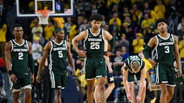 From left, Michigan State's Tyson Walker, Tre Holloman, Malik Hall and Jaden Akins leave the court after losing to Michigan on Saturday, Feb. 18, 2023, at the Crisler Center in Ann Arbor.230218 Msu Mich Bball 270a
