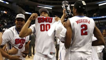 Mar 15, 2015; Hartford, CT, USA; Southern Methodist Mustangs forward Ben Moore (0) and teammates celebrate after defeating the Connecticut Huskies during the final round of the American Conference Tournament at XL Center. SMU defeated Connecticut 62-54. Mandatory Credit: David Butler II-USA TODAY Sports at XL Center.