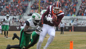 BLACKSBURG, VA - DECEMBER 1: Wide receiver Eric Kumah #83 of the Virginia Tech Hokies catches a touchdown pass against the Marshall Thundering Herd in the first half at Lane Stadium on December 1, 2018 in Blacksburg, Virginia. (Photo by Michael Shroyer/Getty Images)