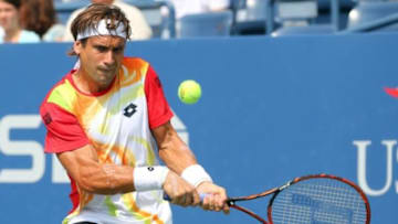 Aug 31, 2014; New York, NY, USA; David Ferrer (ESP) returns a shot to Gilles Simon (FRA) on Armstrong Stadium on day seven of the 2014 U.S. Open tennis tournament at USTA Billie Jean King National Tennis Center. Mandatory Credit: Anthony Gruppuso-USA TODAY Sports