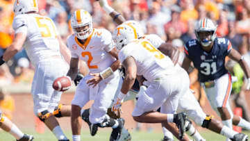AUBURN, AL - OCTOBER 13: Quarterback Jarrett Guarantano #2 of the Tennessee Volunteers hands the ball off to running back Tim Jordan #9 of the Tennessee Volunteers during the second quarter of their game against the Auburn Tigers at Jordan-Hare Stadium on October 13, 2018 in Auburn, Alabama. (Photo by Michael Chang/Getty Images)
