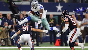 Sep 25, 2016; Arlington, TX, USA; Dallas Cowboys running back Ezekiel Elliott (21) leaps over Chicago Bears safety Chris Prosinski (31) in the fourth quarter at AT&T Stadium. Mandatory Credit: Matthew Emmons-USA TODAY Sports