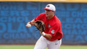 May 24, 2022; Hoover, AL, USA; Georgia shortstop Cole Tate fields a bouncing ball and throws to first to record an out. Alabama faced Georgia in game one of the SEC Tournament at Hoover Met. Mandatory Credit: Gary Cosby Jr.-The Tuscaloosa NewsNcaa Baseball Sec Baseball Tournament Alabama Crimson Tide At Georgia Bulldogs