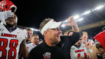 ORLANDO, FLORIDA - DECEMBER 21: Head coach Hugh Freeze of the Liberty Flames celebrates with his team after defeating the Georgia Southern Eagles in the 2019 Cure Bowl at Exploria Stadium on December 21, 2019 in Orlando, Florida. (Photo by James Gilbert/Getty Images)