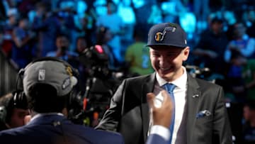 BROOKLYN, NY - JUNE 21: Grayson Allen shakes hands with Donovan Mitchell after being selected twenty-first overall by the Utah Jazz during the 2018 NBA Draft on June 21, 2018 at Barclays Center in Brooklyn, New York. NOTE TO USER: User expressly acknowledges and agrees that, by downloading and or using this photograph, User is consenting to the terms and conditions of the Getty Images License Agreement. Mandatory Copyright Notice: Copyright 2018 NBAE (Photo by Jasear Thompson/NBAE via Getty Images)
