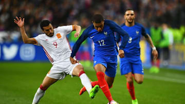 PARIS, FRANCE - MARCH 28: Kylian Mbappe of France is tackled by Pedro of Spain during the International Friendly match between France and Spain at Stade de France on March 28, 2017 in Paris, France. (Photo by Dan Mullan/Getty Images)