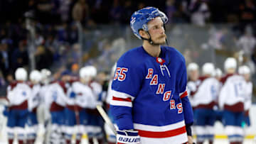 NEW YORK, NEW YORK - OCTOBER 25: Ryan Lindgren #55 of the New York Rangers reacts as the Colorado Avalanche celebrate by winning in a shootout at Madison Square Garden on October 25, 2022 in New York City. The Avalanche won 3-2. (Photo by Sarah Stier/Getty Images)