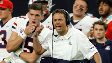 LAS VEGAS, NEVADA - SEPTEMBER 04: Quarterback Will Plummer #15 of the Arizona Wildcats looks on as head coach Jedd Fisch reacts during the Good Sam Vegas Kickoff Classic against the Brigham Young Cougars at Allegiant Stadium on September 4, 2021 in Las Vegas, Nevada. The Cougars defeated the Wildcats 24-16. (Photo by Ethan Miller/Getty Images)