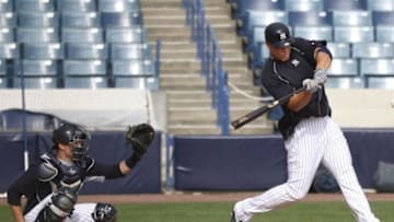 Mar 2, 2015; Tampa, FL, USA; New York Yankees right fielder Aaron Judge (right) bats against catcher Trent Garrison (left) during spring training workouts at George M. Steinbrenner Field. Mandatory Credit: Reinhold Matay-USA TODAY Sports