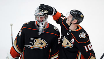 ANAHEIM, CA - MARCH 02: Anaheim Ducks goalie John Gibson (36) and rightwing Corey Perry (10) celebrate on the ice after the Ducks defeated the Columbus Blue Jackets 4 to 2 in a game played on March 2, 2018 at the Honda Center in Anaheim, CA. (Photo by John Cordes/Icon Sportswire via Getty Images)