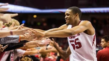 Feb 23, 2016; Fayetteville, AR, USA; Arkansas Razorbacks forward Keaton Miles celebrates with fans in the student section after defeating the LSU Tigers at Bud Walton Arena. The Razorbacks won 85-65. Mandatory Credit: Gunnar Rathbun-USA TODAY Sports